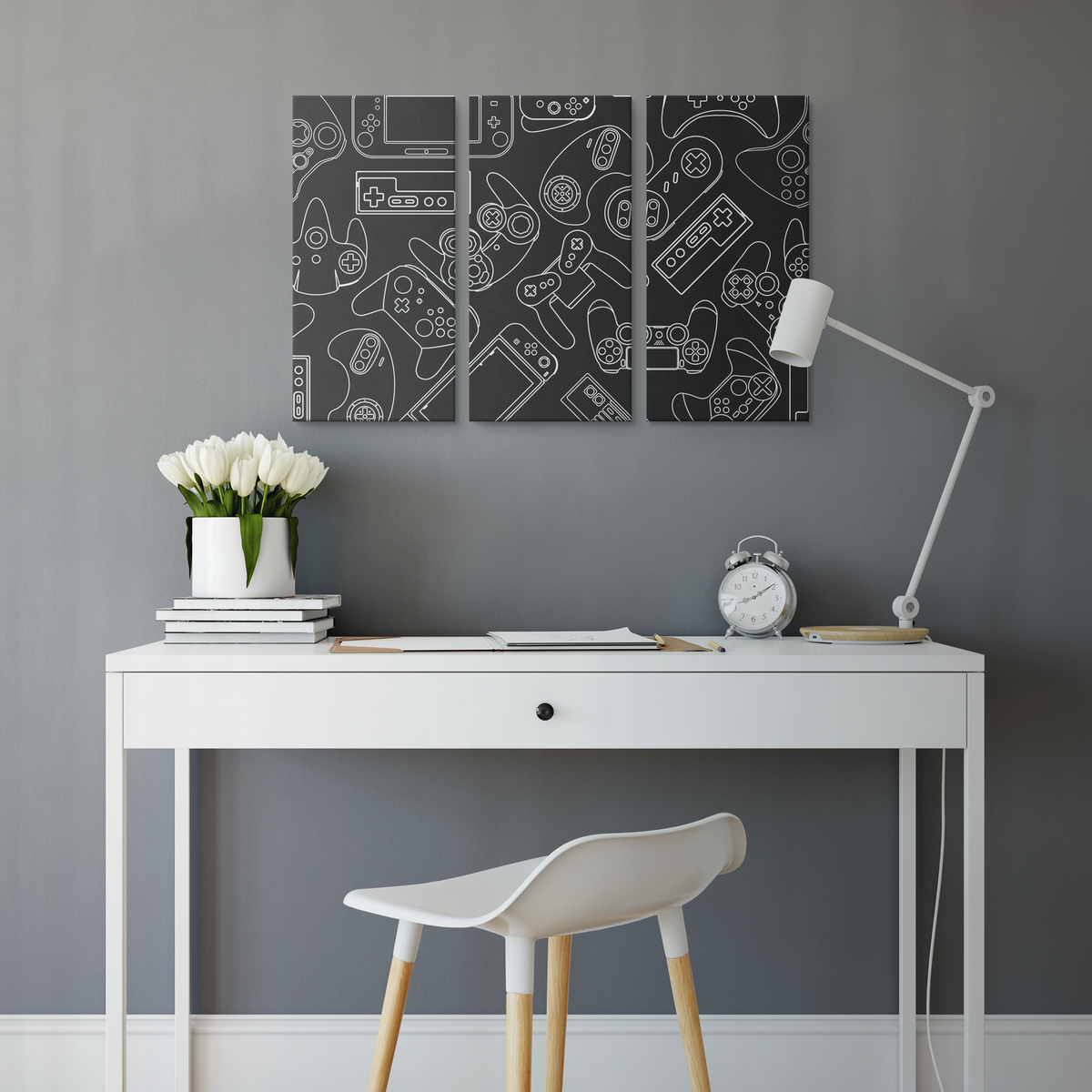 Three-panel controller canvas wall art displayed above a desk